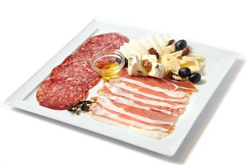 Cheese and Charcuterie on a white plate